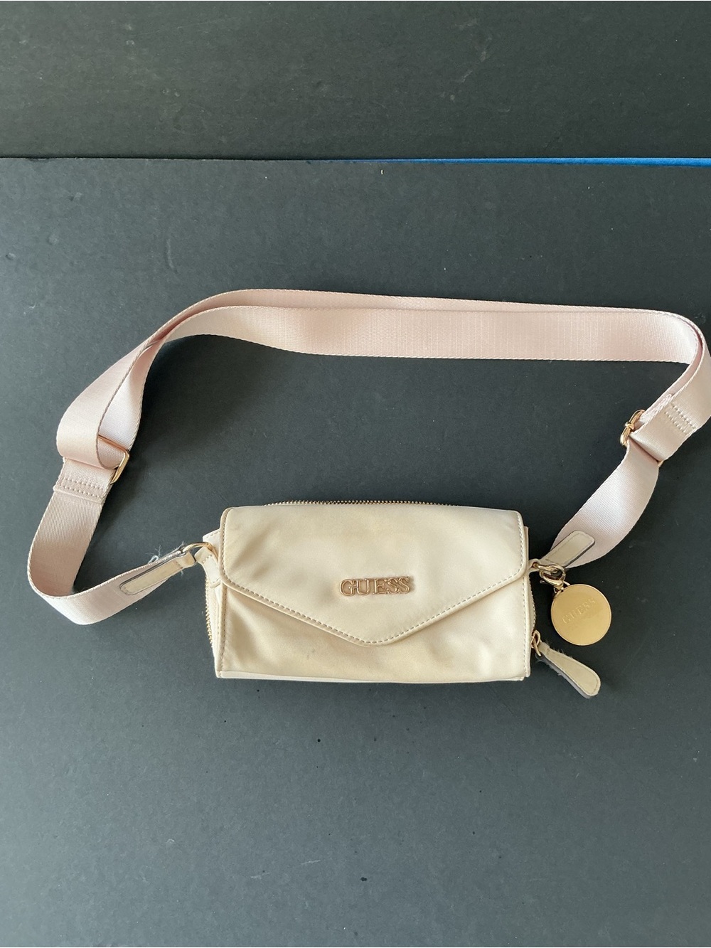 GUESS Cream Crossbody with Gold Logo Medallion and Pink Strap